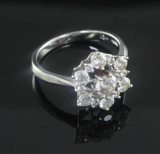 A modern 18ct white gold and diamond cluster ring, size M.